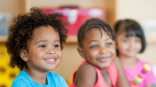 Elementary students listening in the classroom